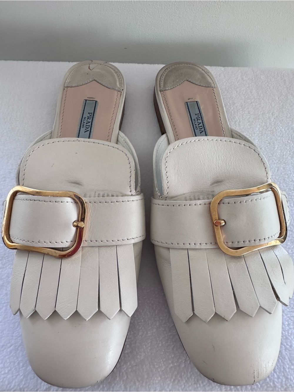 Prada Cream Leather Fringe Slip-On Mules with Gold Buckles